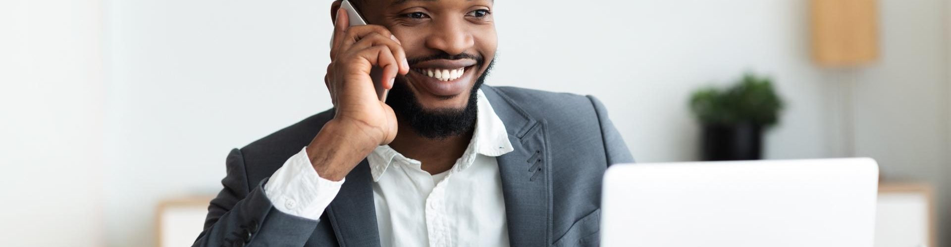 Happy young reseller of mNotify Bulk SMS and Voice SMS